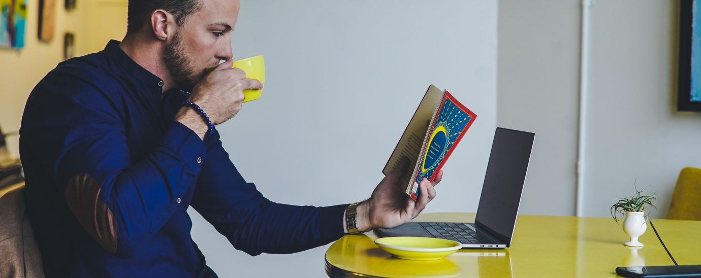 Image of an man reading a book